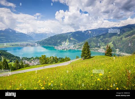 Beautiful Mountain Scenery In The Alps With Clear Lake And Meadows Full