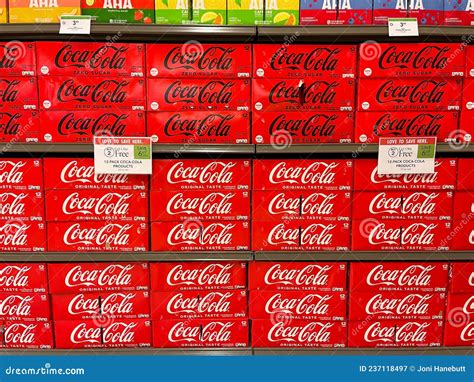 A Display Of Coca Cola Original And Zero Sugar Coca Cola Cases At A