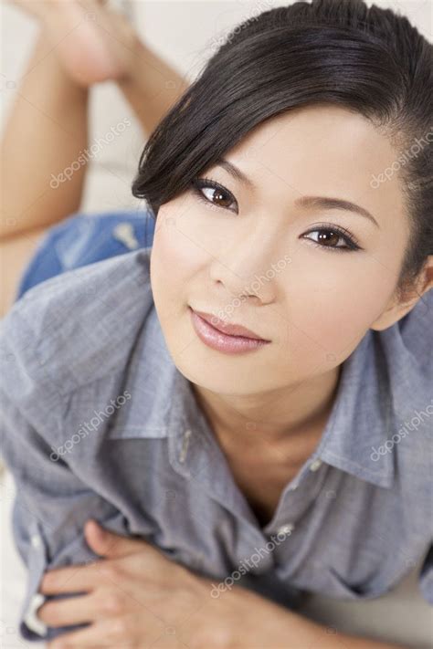 Beautiful Sexy Chinese Asian Woman Laying Down In Denim Shorts Stock Photo By Dmbaker