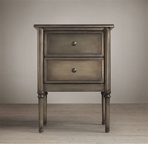 Round black metal nightstands with drawers. ︎