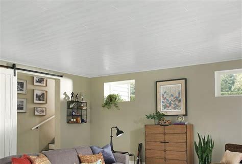 A drop ceiling, also known as a suspended ceiling, is a type of ceiling that's added below an actual ceiling or roof structure. WoodHaven Classic White plank embodies the look of real ...