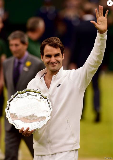 Roger Federer With His Trophy After Losing To Novak Djokovic In The