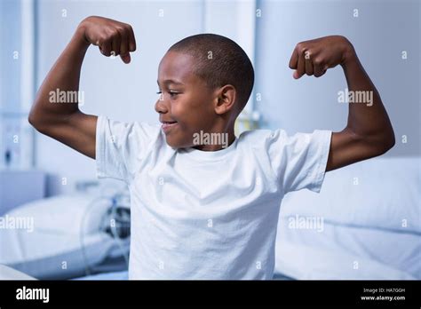 Boy Flexing His Muscles In Ward Stock Photo Alamy