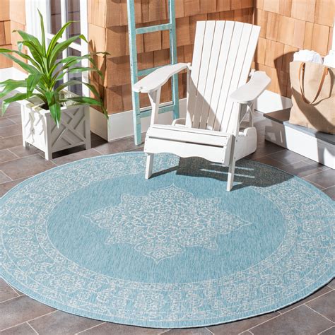 It's easy on the feet and easily cleaned with a damp cloth. Safavieh Courtyard Delbet Distressed Medallion Indoor ...