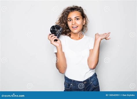 Portrait Of Beautiful Young Curly Latin Woman Photographer Holding