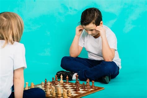 Premium Photo Two Boys Playing Chess Studio Background Sport