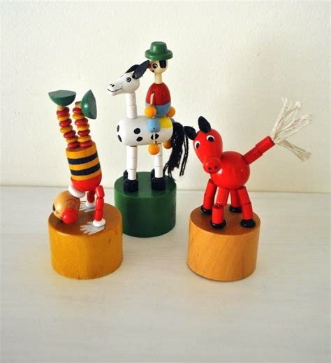 Wooden Figures With Elastic Push In On The Bottom And They Collapse