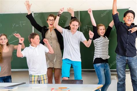 Teacher Motivating Students In School Class Stock Photo By ©kzenon 82619044