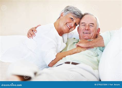 Mature Couple Relaxing At Home Portrait Of Loving Mature Couple