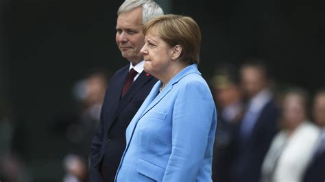 Germanys Angela Merkel Seen Shaking During Ceremony