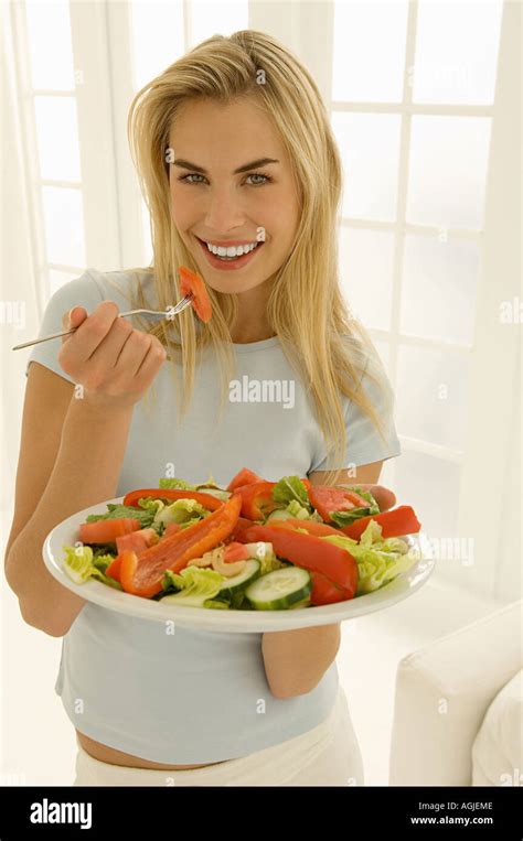 Woman Eating Salad Stock Photo Alamy