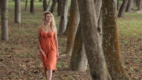 Young Blonde Woman Walking Through Forest Stock Video Footage Storyblocks