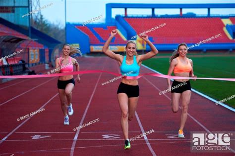 Female Runners Finishing Athletic Race Together Stock Photo Picture