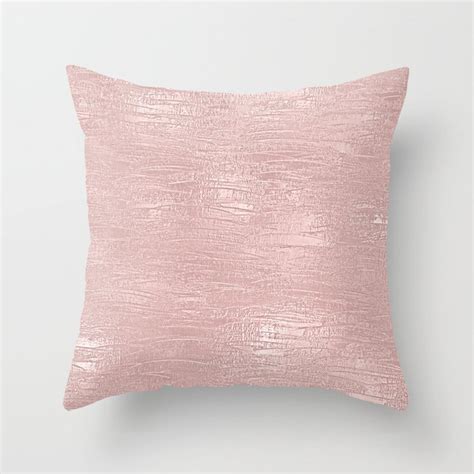 A Pink Pillow On A White Wall