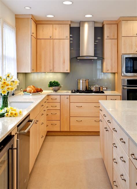 Open frame kitchen cabinets can look more modern or more traditional, depending on the design of the kitchen and the hardware of the cabinets. maple flat front cabinets modern | natural finish maple ...