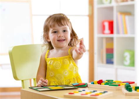 Kindergarten Child Plays In The Sorter At The Table Stock Image Image