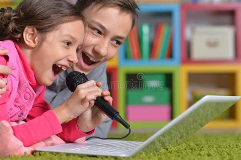 Adorable Little Girl And Boy Singing Karaoke Stock Image Image Of