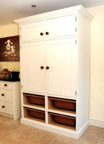 Pantry cabinets, also known as storage cabinets are freestanding units that are typically made of 2. tall cabinet standing alone on wall in kitchen - Yahoo ...