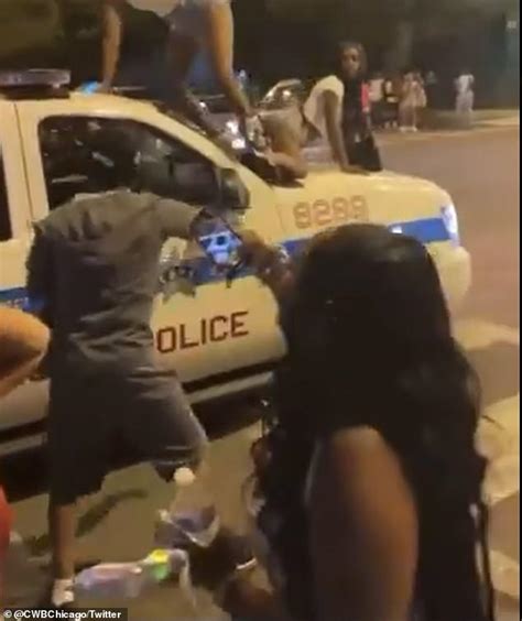 police launch an investigation after three women are filmed twerking on top of a cop car in