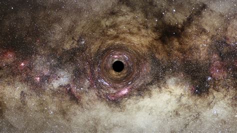 Gravitational Light Bending Reveals One Of The Largest Black Holes Ever
