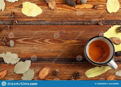 Yellow Autumn Leaves And A Glass Of Tea On A Dark Old