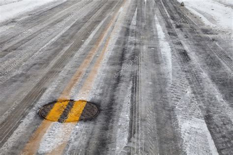 Slippery Icy Road With Yellow Line — Stock Photo © Pixelsaway 2061556