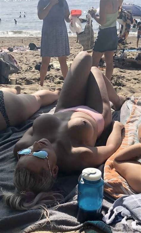 Blonde Tanning Topless By The Edge Of The Non Nude Beach Hd Porn Pics