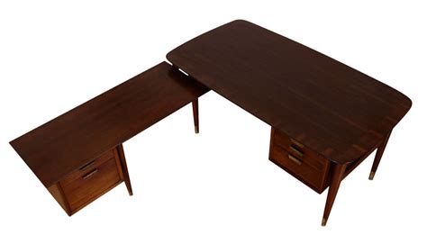 Investing in a proper work desk is an obvious place to start, but you want to make sure it'll look good in your home, too — especially if you don't have space for a totally separate home. Mid Century Modern L-Shaped Executive Desk | Modernism