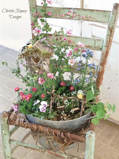 An Old Chair Is Filled With Flowers And Plants