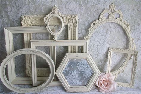 An Assortment Of White Frames With Flowers On Them