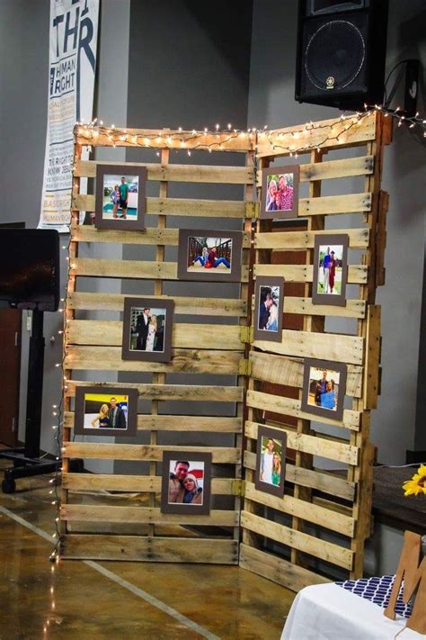 Greenery is a great addition to a photo booth wall because it is durable and will last all evening long. Wedding pallet wall picture display | Pallet wedding ...