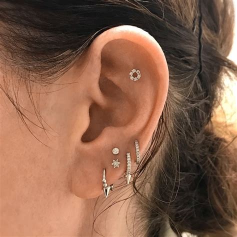 I am not kidding girls, this is 2019! A clever arrangement of studs and rings make up this ...