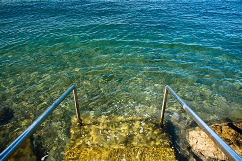 Entering Beautiful Crystal Clear Adriatic Sea In Summer Stock Photo