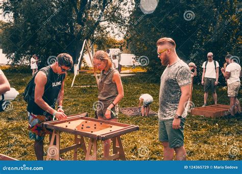 Young People Plays Wooden Board Games In A Park Editorial Stock Image