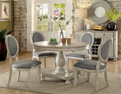 For a sleek, modern appearance, try a glass top dining room set with a clear pane resting on a metal base. Bloomingdale 5 Piece Dining Set | Round dining room sets ...