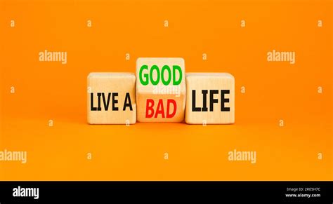 Live good life symbol. Concept word Live a good or bad life on wooden