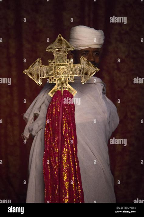 Portrait Of An Ethiopian Orthodox Priest Holding A Cross In The
