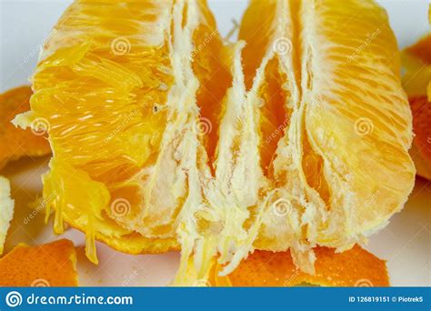 Peeled Orange With Very Thick Skin On A White Kitchen Table Cit Stock