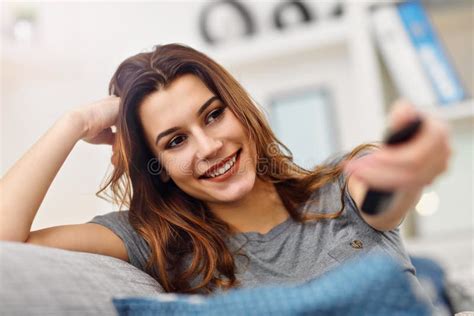 Beautiful Young Woman Relaxing At Home Watching Tv Stock Image Image