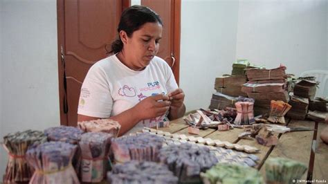 Venezuela′s Worthless Currency Turns Into Bags Of Money Americas
