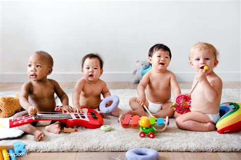 Babies Playing Together In A Play Room Premium Image By