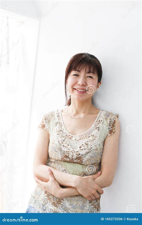 Japanese Middle Aged Woman Enjoys Flower Seedling Planting Terrace Royalty Free Stock Image