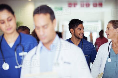 Doctors And Nurses Talking In Hospital Hallway Stock Photo Dissolve