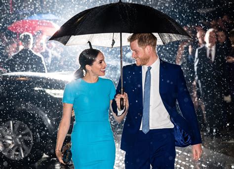 That Magical Photo Of Meghan Markle And Prince Harry In The Rain Has