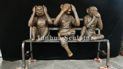 Three Wise Bronze Monkeys Statue On Bench No Speak No Word No Listen