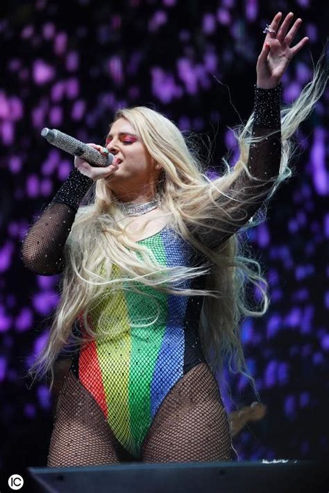 singer meghan trainor is seen wearing a pride bathing suit while singing live on stage in west