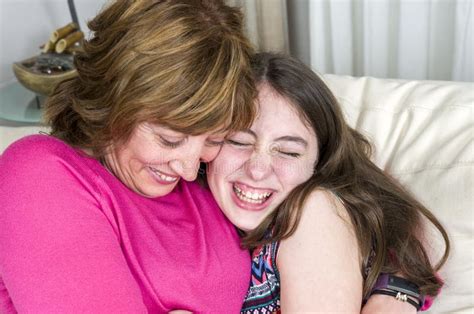 Woman And Her Daughter Are Hugging In Their Couch Mother`s Day Stock Image Image Of Little