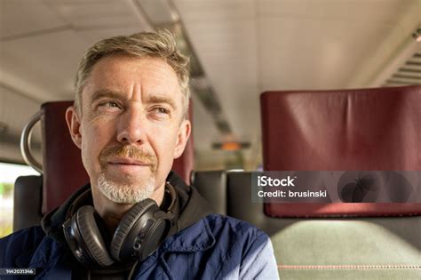 50 Year Old White Male Travels On A Train Stock Photo Download Image