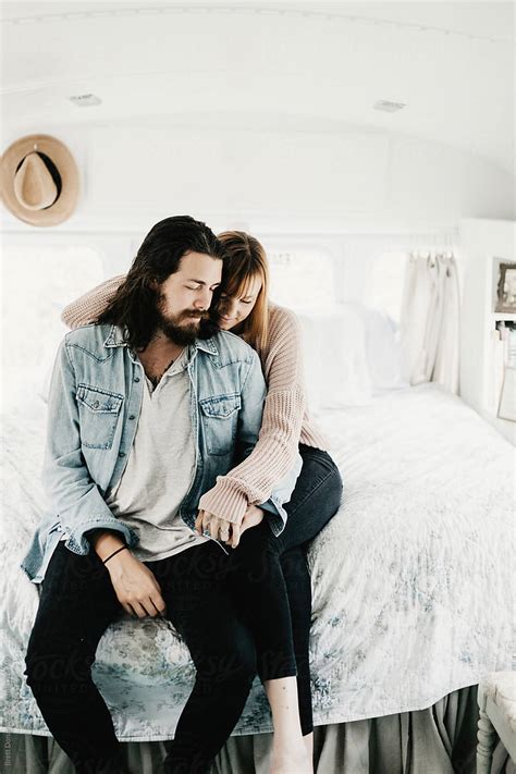 Cute Hipster Couple Cuddling In Converted School Bus Tiny Home By Stocksy Contributor Brett