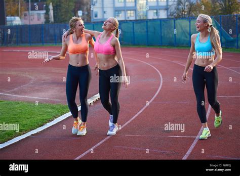 Athlete Woman Group Running On Athletics Race Track Stock Photo Alamy